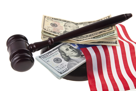 dollars, wooden hammer and US flag isolated on white backgroundの写真素材
