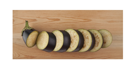 eggplant on a wooden board isolated on a white backgroundの写真素材