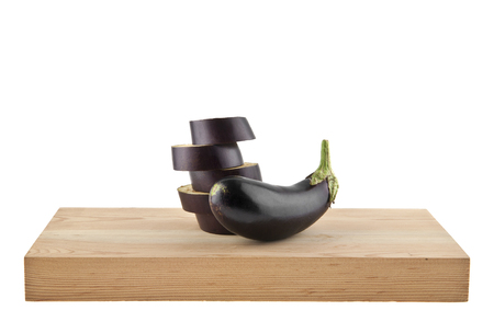 eggplant on a wooden board isolated on a white backgroundの写真素材