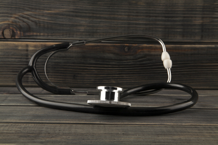 stethoscope on a wooden backgroundの写真素材