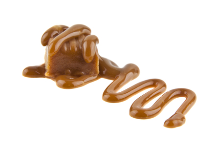 caramel isolated on a white background closeupの写真素材