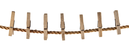 wooden clothespin on a rope isolated on white background closeupの写真素材