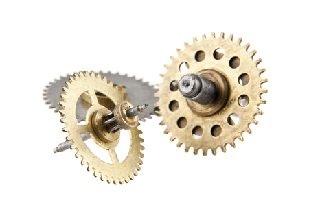 gears from old clock isolated on white backgroundの写真素材