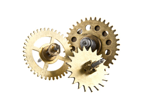 gears from old clock isolated on white backgroundの写真素材