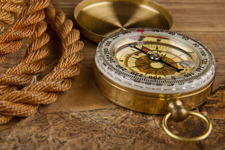 old paper, rope and compass on a wooden tableの写真素材