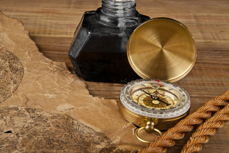 old paper, rope and compass on a wooden tableの写真素材