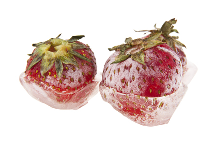 frozen strawberries isolated on white backgroundの写真素材