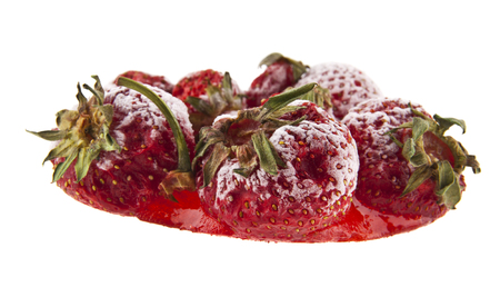 frozen strawberries isolated on white backgroundの写真素材