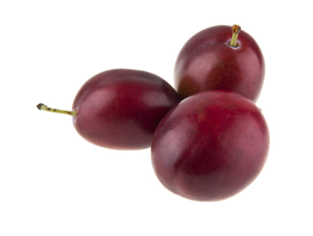 plums isolated on white backgroundの写真素材