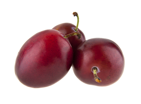 plums isolated on white backgroundの写真素材