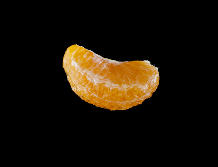 oranges in drops of water on a black background closeupの写真素材