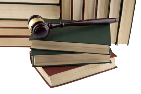 wooden hammer and books isolated on white background close-upの写真素材