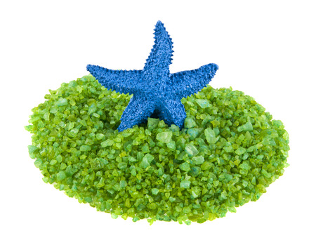 blue starfish and sea salt isolated on white background closeupの写真素材
