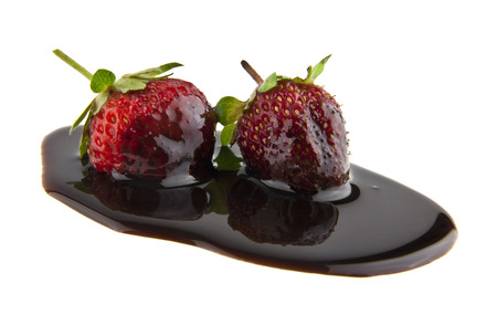 strawberry in chocolate isolated on white background closeupの写真素材