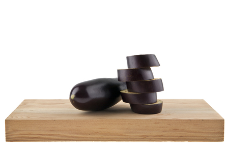eggplant on wooden Board isolated on white background closeupの写真素材
