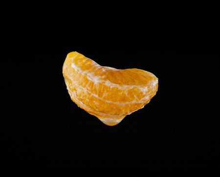 Mandarin on a black background closeupの写真素材