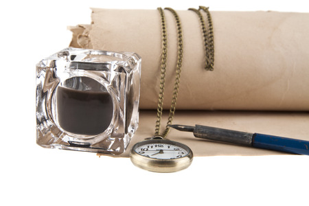 old paper, clock, inkwell and pen isolated on white background closeup