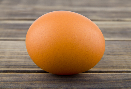 chicken eggs on wooden backgroundの写真素材