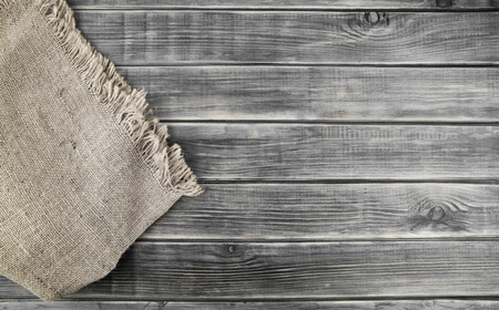 cloth burlap on wooden table, wooden background