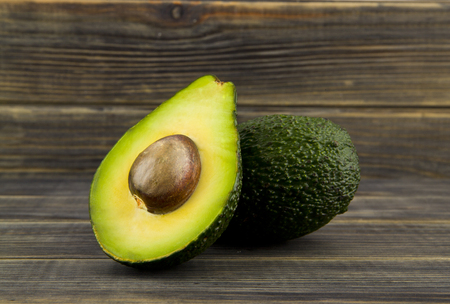 food with fresh organic avocado on wooden tableの写真素材
