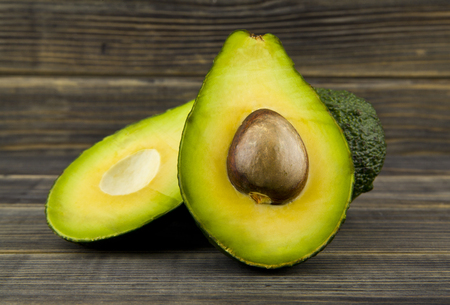 food with fresh organic avocado on wooden tableの写真素材