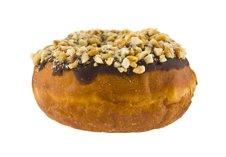 donut in chocolate with nuts isolated on white backgroundの写真素材