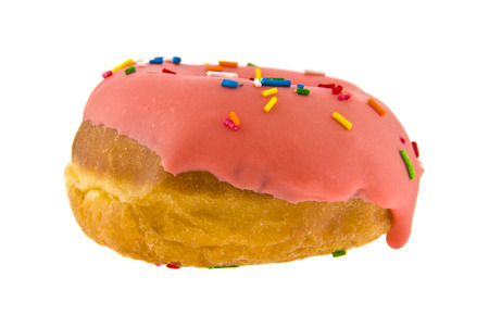 pink iced donut isolated on white backgroundの写真素材