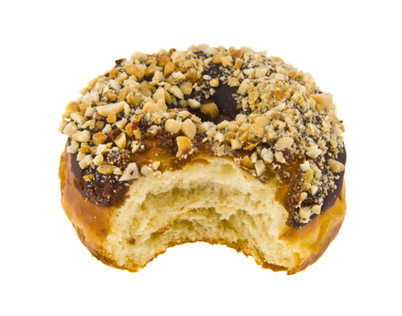 donut in chocolate with nuts isolated on white backgroundの写真素材