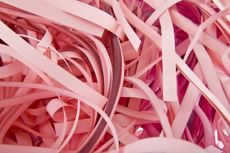 strips of pink paper as backgroundの写真素材