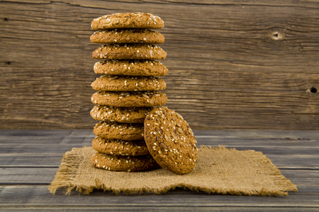 Cookies with seeds on a woodenの写真素材