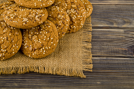 Cookies with seeds on a woodenの写真素材