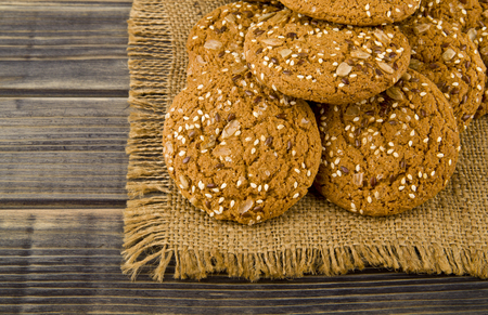 Cookies with seeds on a woodenの写真素材