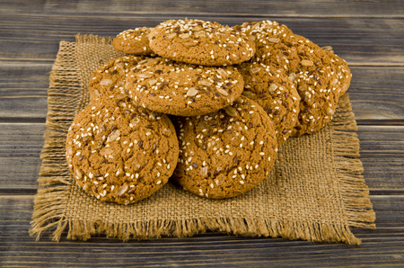 Cookies with seeds on a woodenの写真素材