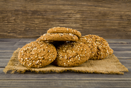 Cookies with seeds on a woodenの写真素材