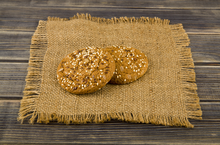 Cookies with seeds on a woodenの写真素材