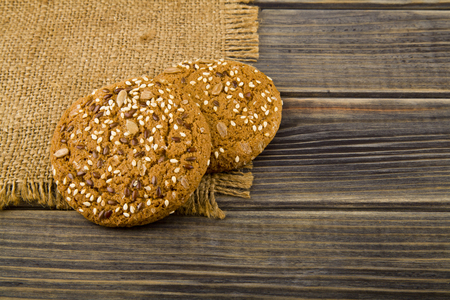 Cookies with seeds on a woodenの写真素材