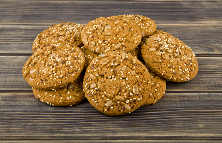 Cookies with seeds on a woodenの写真素材
