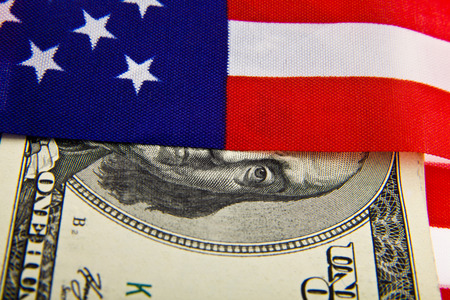 dollars and usa flag as backgroundの写真素材