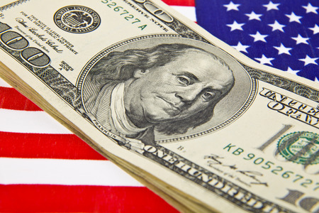 dollars and usa flag as backgroundの写真素材