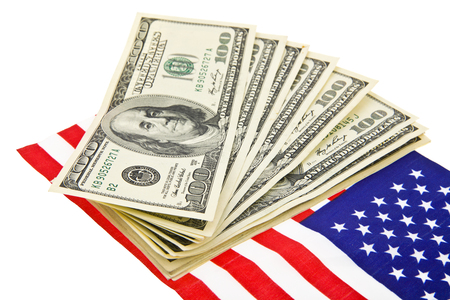 dollars and USA flag isolated on white backgroundの写真素材