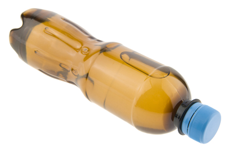 Brown plastic bottle isolated on whiteの写真素材