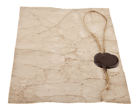 Old paper with a wax seal isolated on whiteの写真素材