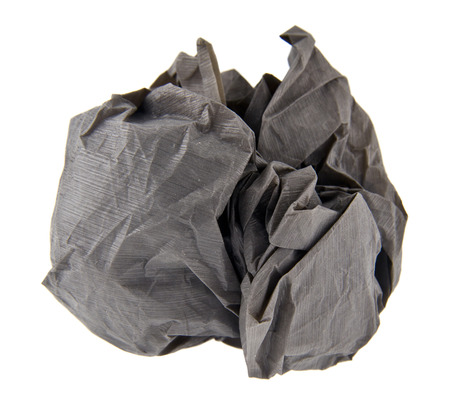 Wad of crumpled gray paper isolated on whiteの写真素材