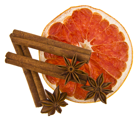 grapefruit and cinnamon isolated on white backgroundの写真素材