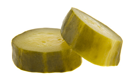 salted cucumber isolated on white backgroundの写真素材