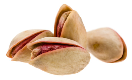 pistachios isolated on white backgroundの写真素材