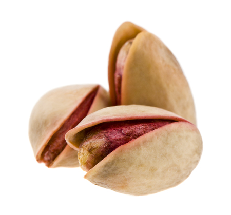 pistachios isolated on white backgroundの写真素材