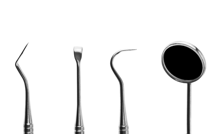 dentist tools isolated on white backgroundの写真素材
