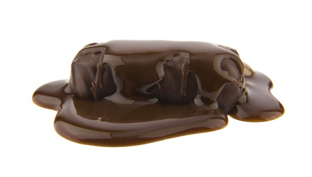 chocolate candy covered with chocolate isolated on white backgroundの写真素材
