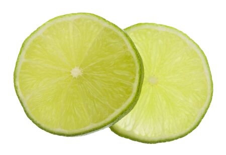 Sliced lime green isolated on white background close-up.の写真素材